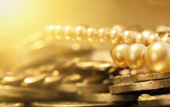 Pearls and gold coins - web banner of wealth, luxury concept